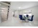 Dining room with glass table and stairway access to upper floors at 1712 Azalea Ct # A, Oldsmar, FL 34677