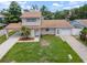 Aerial view of the front exterior, showing the home's carport and attached garage at 1712 Azalea Ct # A, Oldsmar, FL 34677
