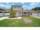 Charming two-story home with well-maintained lawn, a carport, and a single-car garage at 1712 Azalea Ct # A, Oldsmar, FL 34677
