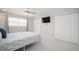Bright main bedroom with tile floors, two closets and a ceiling fan at 1712 Azalea Ct # A, Oldsmar, FL 34677