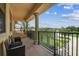 A covered outdoor balcony provides an area to sit and view the community at 17914 Howsmoor Pl, Lutz, FL 33559