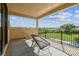 Outdoor balcony with patio furniture and green backyard views, perfect for relaxing at 17914 Howsmoor Pl, Lutz, FL 33559