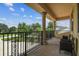 View of the balcony overlooking the front yard at 17914 Howsmoor Pl, Lutz, FL 33559