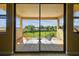 Balcony with neutral-colored furniture and a picturesque view of lush greenery and blue skies at 17914 Howsmoor Pl, Lutz, FL 33559