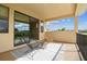 Outdoor balcony with patio furniture and open view of the backyard at 17914 Howsmoor Pl, Lutz, FL 33559