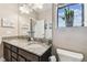 Bathroom showcasing double sinks, granite countertops, and a toilet at 17914 Howsmoor Pl, Lutz, FL 33559