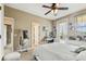 Bedroom showing natural light and a mirror, plus access to the outdoor balcony at 17914 Howsmoor Pl, Lutz, FL 33559