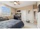 This bedroom has neutral walls and ceiling fan with light plus a desk space for work at 17914 Howsmoor Pl, Lutz, FL 33559