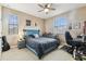 This bedroom features neutral walls, ceiling fan and light, and carpeted flooring at 17914 Howsmoor Pl, Lutz, FL 33559