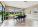 Dining area with a view to the backyard and pool at 17914 Howsmoor Pl, Lutz, FL 33559