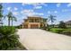 Stunning two-story home featuring an oversized driveway and manicured landscaping at 17914 Howsmoor Pl, Lutz, FL 33559