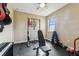 Exercise room with weightlifting equipment and a ceiling fan at 17914 Howsmoor Pl, Lutz, FL 33559