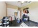 Home gym equipped with free weights, a piano, and guitars at 17914 Howsmoor Pl, Lutz, FL 33559