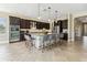 Large kitchen island with stainless steel appliances and bar seating at 17914 Howsmoor Pl, Lutz, FL 33559