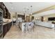 Open kitchen with island, stainless steel appliances, and easy access to the living area at 17914 Howsmoor Pl, Lutz, FL 33559