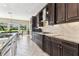 Well-equipped kitchen with granite counters, stainless appliances, and ample cabinet space at 17914 Howsmoor Pl, Lutz, FL 33559
