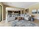Inviting living room showcasing an open layout to the kitchen, perfect for modern living at 17914 Howsmoor Pl, Lutz, FL 33559