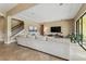 Comfortable living room with neutral colors, and lots of natural light at 17914 Howsmoor Pl, Lutz, FL 33559