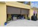 Covered patio features comfortable seating, a ceiling fan and outdoor shades, perfect for enjoying the outdoors at 17914 Howsmoor Pl, Lutz, FL 33559