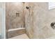 Tiled shower with built-in bench and recessed niche at 17914 Howsmoor Pl, Lutz, FL 33559