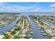 Aerial view showcasing the canal-front home’s location within a community of waterfront properties near the bay at 1960 Kansas Ne Ave, St Petersburg, FL 33703