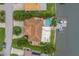 Aerial view highlighting the home's layout, pool, waterfront location, and lush landscaping on a prime lot at 1960 Kansas Ne Ave, St Petersburg, FL 33703