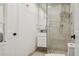 Modern bathroom with tiled stand up shower and sleek floating vanity and sink at 1960 Kansas Ne Ave, St Petersburg, FL 33703