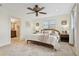 Relaxing bedroom featuring a neutral palette, cozy bedding, and en suite bathroom access at 1960 Kansas Ne Ave, St Petersburg, FL 33703
