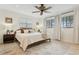 Serene bedroom with neutral colors, plush bedding, and lots of natural light at 1960 Kansas Ne Ave, St Petersburg, FL 33703