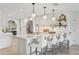 Bright and airy kitchen featuring white cabinets, quartz countertops, stainless appliances, and a large island at 1960 Kansas Ne Ave, St Petersburg, FL 33703