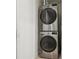 Stacked washer and dryer with stainless steel finish offer convenient laundry solution at 1960 Kansas Ne Ave, St Petersburg, FL 33703