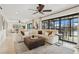 Comfortable living area with sectional sofa, plush rug, and a view of the outdoors at 1960 Kansas Ne Ave, St Petersburg, FL 33703