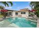 Sparkling pool and spa area with stylish lounge chairs, creating a relaxing backyard oasis at 1960 Kansas Ne Ave, St Petersburg, FL 33703