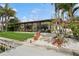 Charming rear exterior with covered patio, lush landscaping, and waterfront views, perfect for outdoor living at 1960 Kansas Ne Ave, St Petersburg, FL 33703