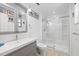 Clean, bright bathroom with a large vanity, modern fixtures, and glass-enclosed shower at 1983 Seton Dr, Clearwater, FL 33763
