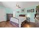 Cozy bedroom with wood floors, soft lighting, and calming colors, creating a relaxing retreat at 1983 Seton Dr, Clearwater, FL 33763