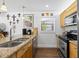 Bright kitchen with granite countertops, stainless appliances, and stylish tile backsplash at 1983 Seton Dr, Clearwater, FL 33763