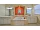 Bright bathroom features a soaking tub, dual sinks, and neutral tile at 2239 Sifield Greens Way # 84, Sun City Center, FL 33573