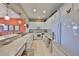 Bright kitchen features white cabinets and modern appliances with an open layout to the dining area at 2239 Sifield Greens Way # 84, Sun City Center, FL 33573