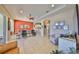 Spacious living area with tile flooring, an open layout, and a view of the kitchen and dining area at 2239 Sifield Greens Way # 84, Sun City Center, FL 33573