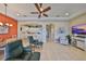 Expansive living area featuring an open floor plan to the kitchen, dining, and multiple seating arrangements at 2239 Sifield Greens Way # 84, Sun City Center, FL 33573