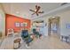 Open concept living area with tile floors, adjacent dining space, and an easy flow to the kitchen at 2239 Sifield Greens Way # 84, Sun City Center, FL 33573