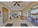 Open living room and dining area with patio access at 2239 Sifield Greens Way # 84, Sun City Center, FL 33573