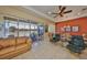 Inviting living area with a comfortable sofa, views of the patio, and easy access to outdoor spaces at 2239 Sifield Greens Way # 84, Sun City Center, FL 33573