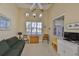 Relaxing living room with vaulted ceiling, natural light, and comfortable seating at 2239 Sifield Greens Way # 84, Sun City Center, FL 33573