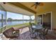 Screened in patio with brick flooring and a view of the lake at 2239 Sifield Greens Way # 84, Sun City Center, FL 33573