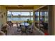Screened in patio with brick flooring and a view of the lake at 2239 Sifield Greens Way # 84, Sun City Center, FL 33573