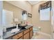 Bathroom featuring dark granite countertops and a unique vessel sink at 23320 Dinhurst Ct, Land O Lakes, FL 34639