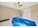 bedroom with carpet flooring, a ceiling fan, and a fun themed bed at 23320 Dinhurst Ct, Land O Lakes, FL 34639