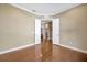 Bedroom featuring hardwood floors and an open doorway at 23320 Dinhurst Ct, Land O Lakes, FL 34639